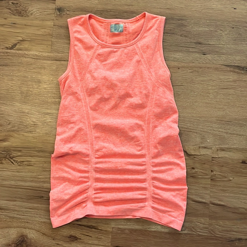 NWOT size small Athleta muscle tank in a orange coral color.